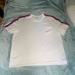 cotton white shirt, blue and red accents, brand logo on lower front hemline